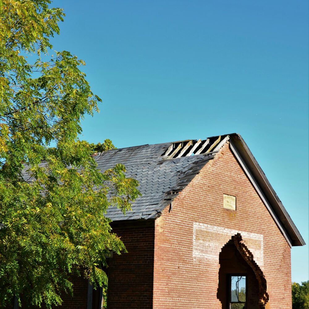 Building with hole in wall by Roger Starnes Sr