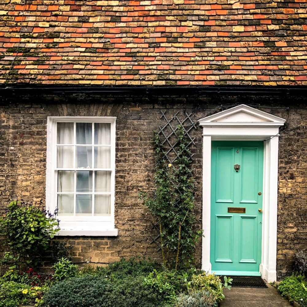 Green door to a cottage by Fatih on Unsplash