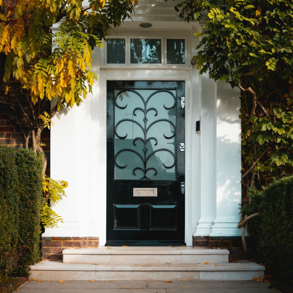 London front door with trees by Andrea De Santis on Unsplash