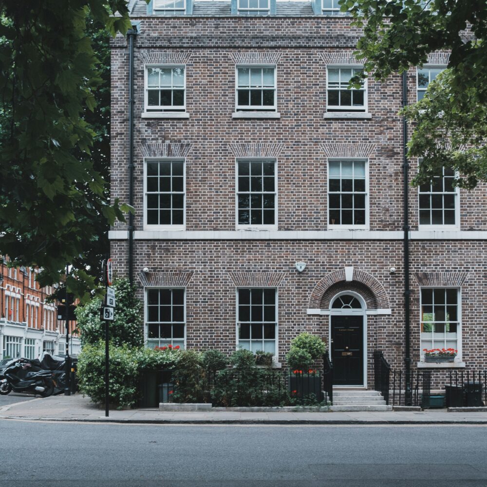 A brick building with a black door in Highbury, London